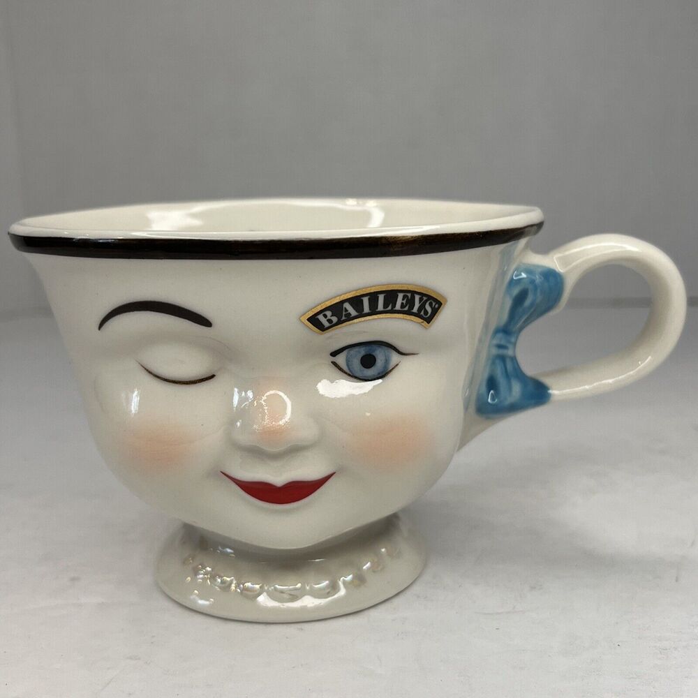 Baileys Irish Cream Lady YUM Tea Cup with Winking Eye and Blue Ribbon.